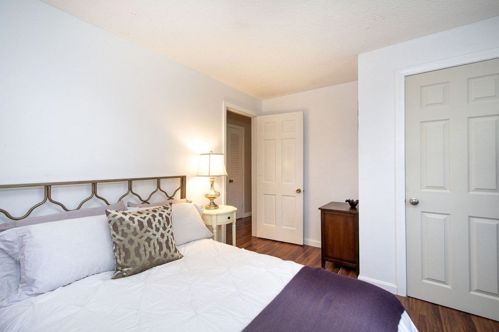 32 Shadwell Road Scituate, MA 02066 - Photo 23 of 32 a bedroom with a bed and a mirror