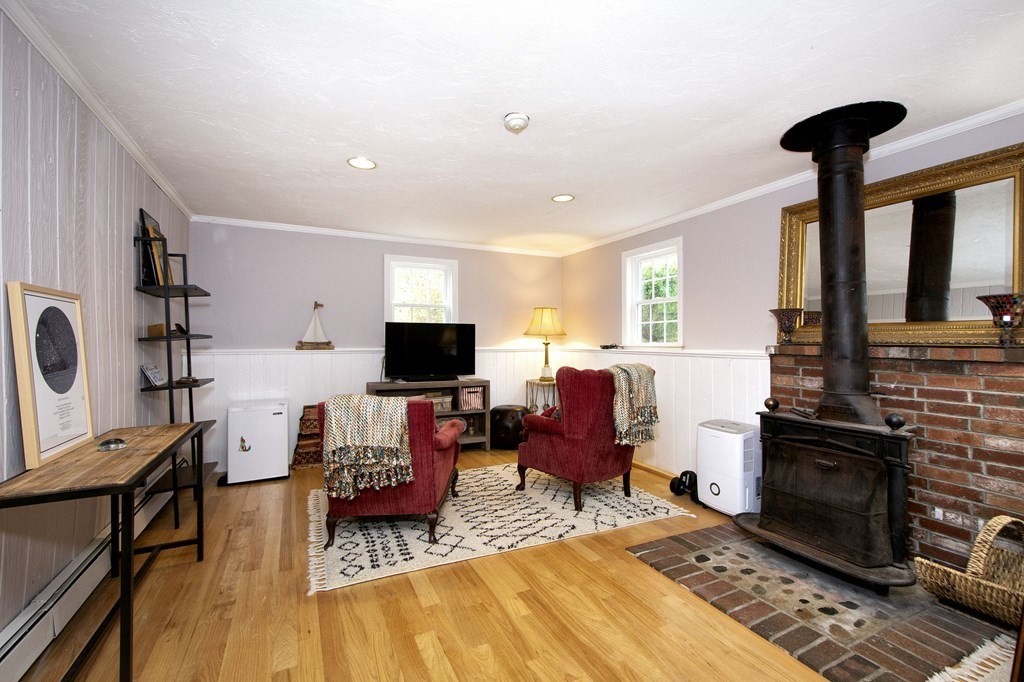 32 Shadwell Road Scituate, MA 02066 - Photo 24 of 32 a living room with furniture and a fireplace