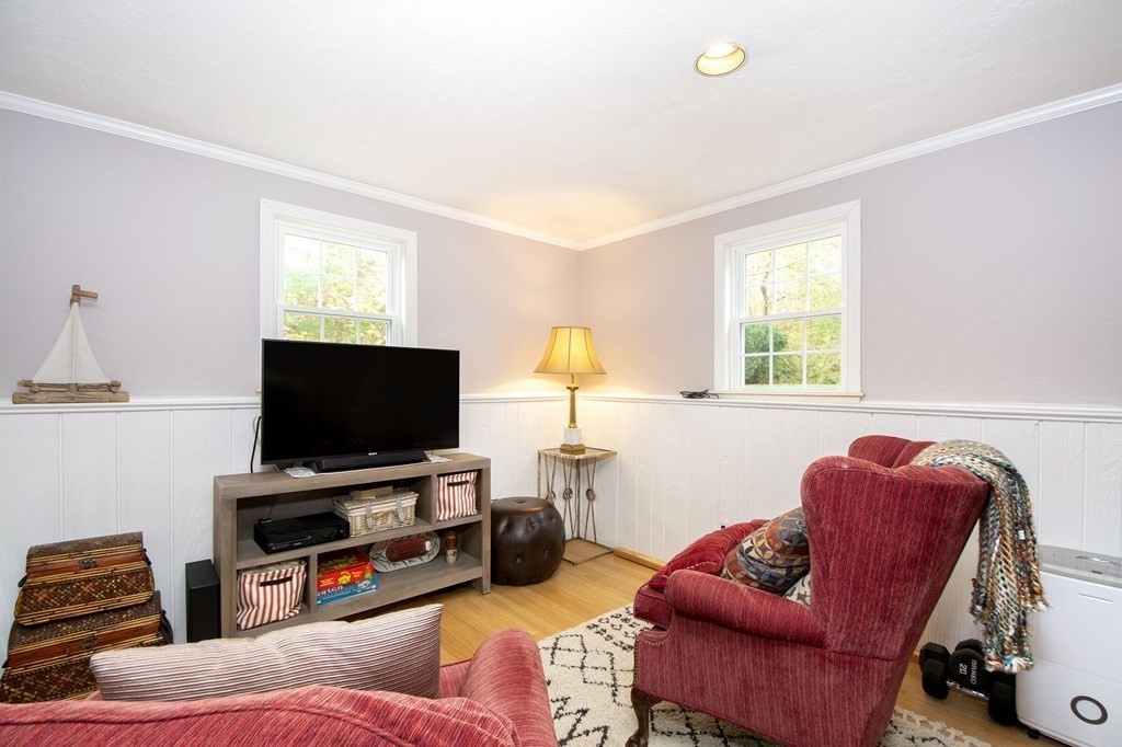 32 Shadwell Road Scituate, MA 02066 - Photo 25 of 32 a living room with furniture and a flat screen tv