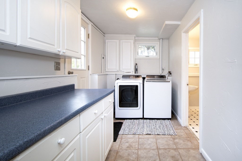 32 Shadwell Road Scituate, MA 02066 - Photo 27 of 32 a kitchen with stainless steel appliances granite countertop a stove a sink and white cabinets