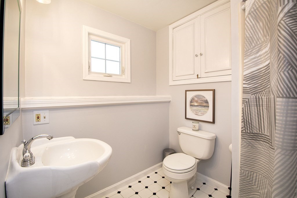 32 Shadwell Road Scituate, MA 02066 - Photo 28 of 32 a white toilet sitting next to a bathroom sink