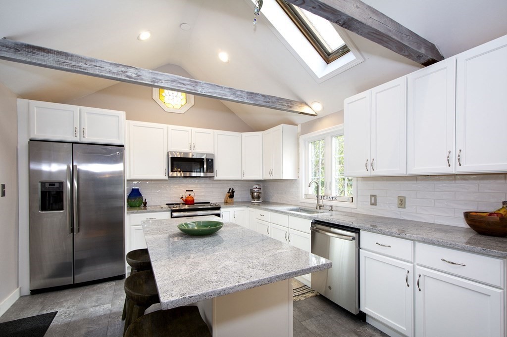 32 Shadwell Road Scituate, MA 02066 - Photo 6 of 32 a kitchen with stainless steel appliances granite countertop a sink refrigerator and cabinets
