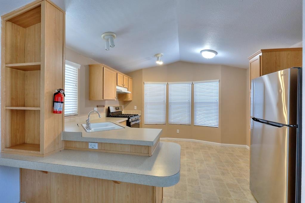 3506 Homestead Way Ceres, CA 95307 - Photo 12 of 39 a large white kitchen with a large window