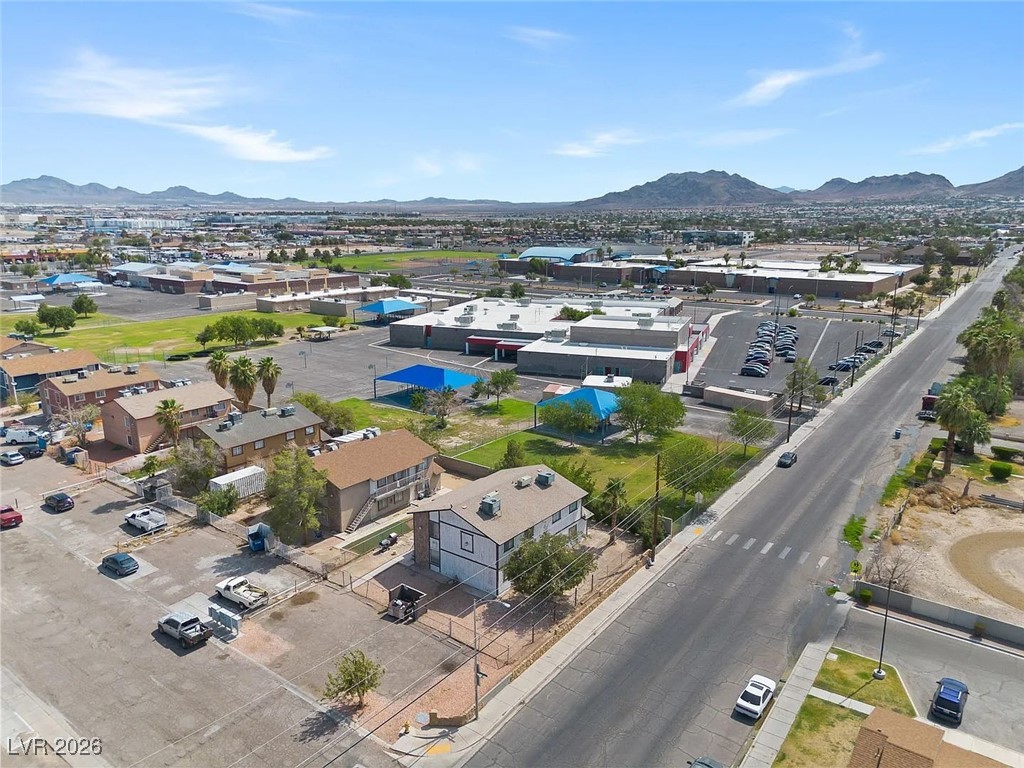 1812 Fulstone Way, Unit 2 Las Vegas, NV 89115 - Photo 8 of 9 Aerial perspective of suburban area featuring a mountain backdrop