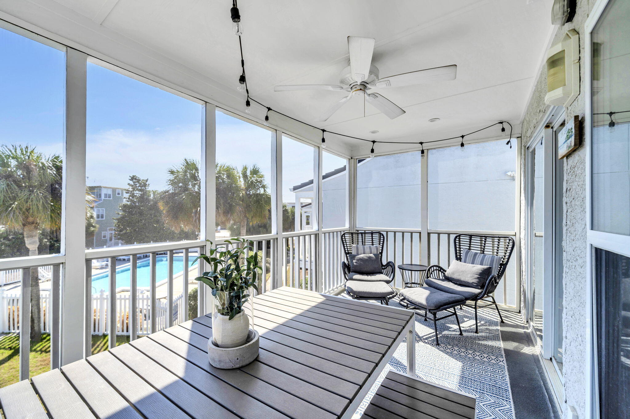 4984 West County Highway 30A, Unit 4B Santa Rosa Beach, FL 32459 - Photo 21 of 37 a view of balcony with wooden floor and outdoor seating