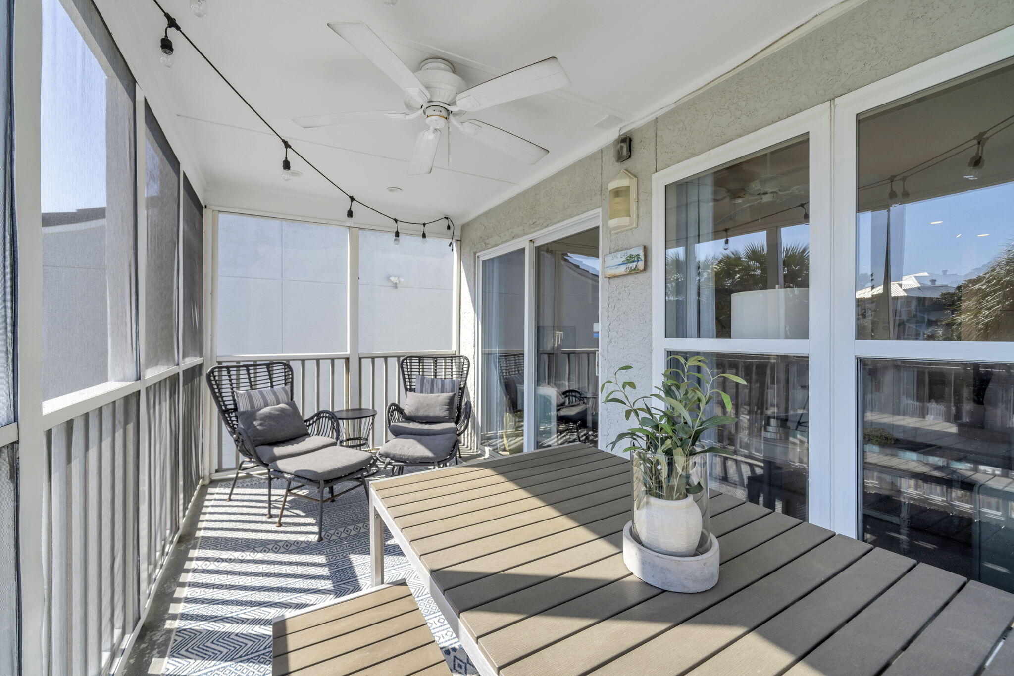 4984 West County Highway 30A, Unit 4B Santa Rosa Beach, FL 32459 - Photo 23 of 37 a view of a patio with wooden floor