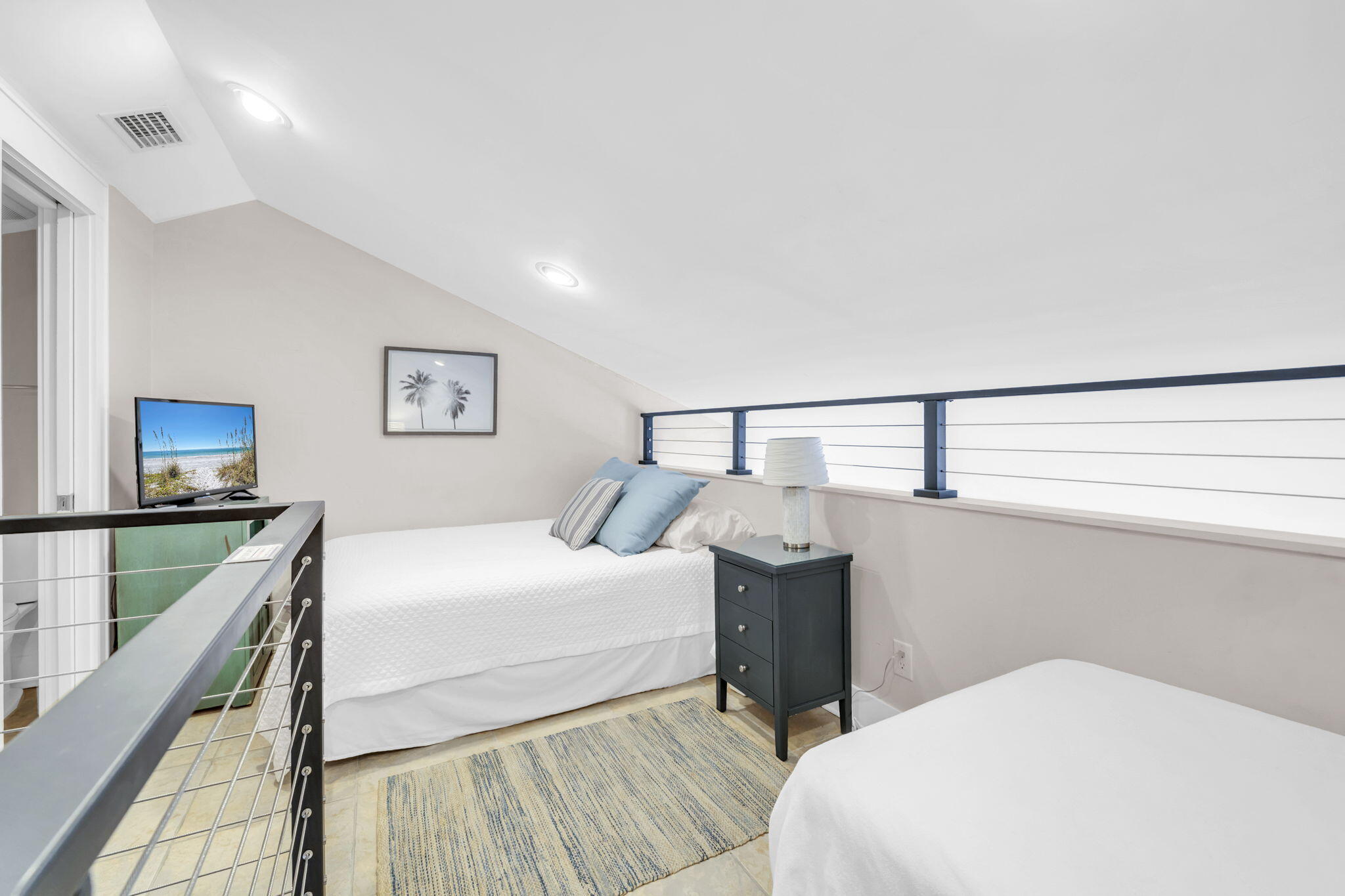 4984 West County Highway 30A, Unit 4B Santa Rosa Beach, FL 32459 - Photo 26 of 37 a bedroom with a bed and a window
