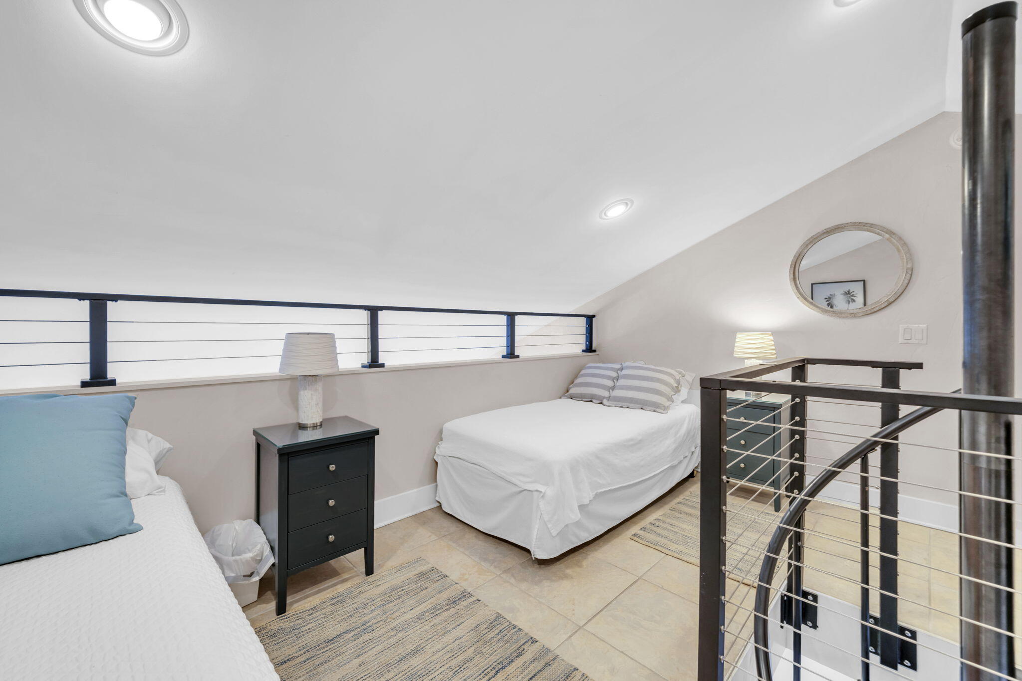 4984 West County Highway 30A, Unit 4B Santa Rosa Beach, FL 32459 - Photo 27 of 37 a bedroom with a bed and a chandelier