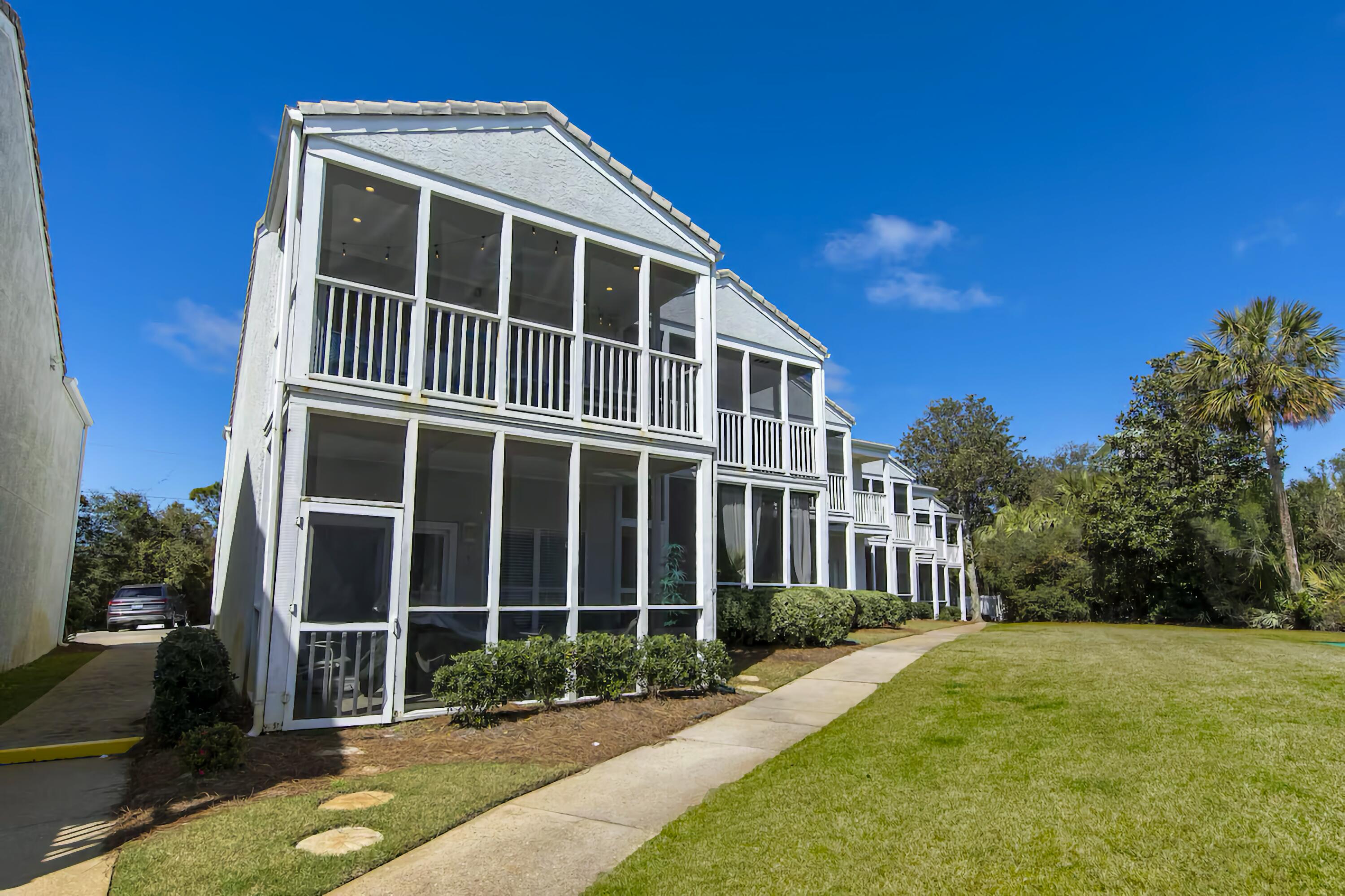 4984 West County Highway 30A, Unit 4B Santa Rosa Beach, FL 32459 - Photo 32 of 37 a front view of a house with a yard