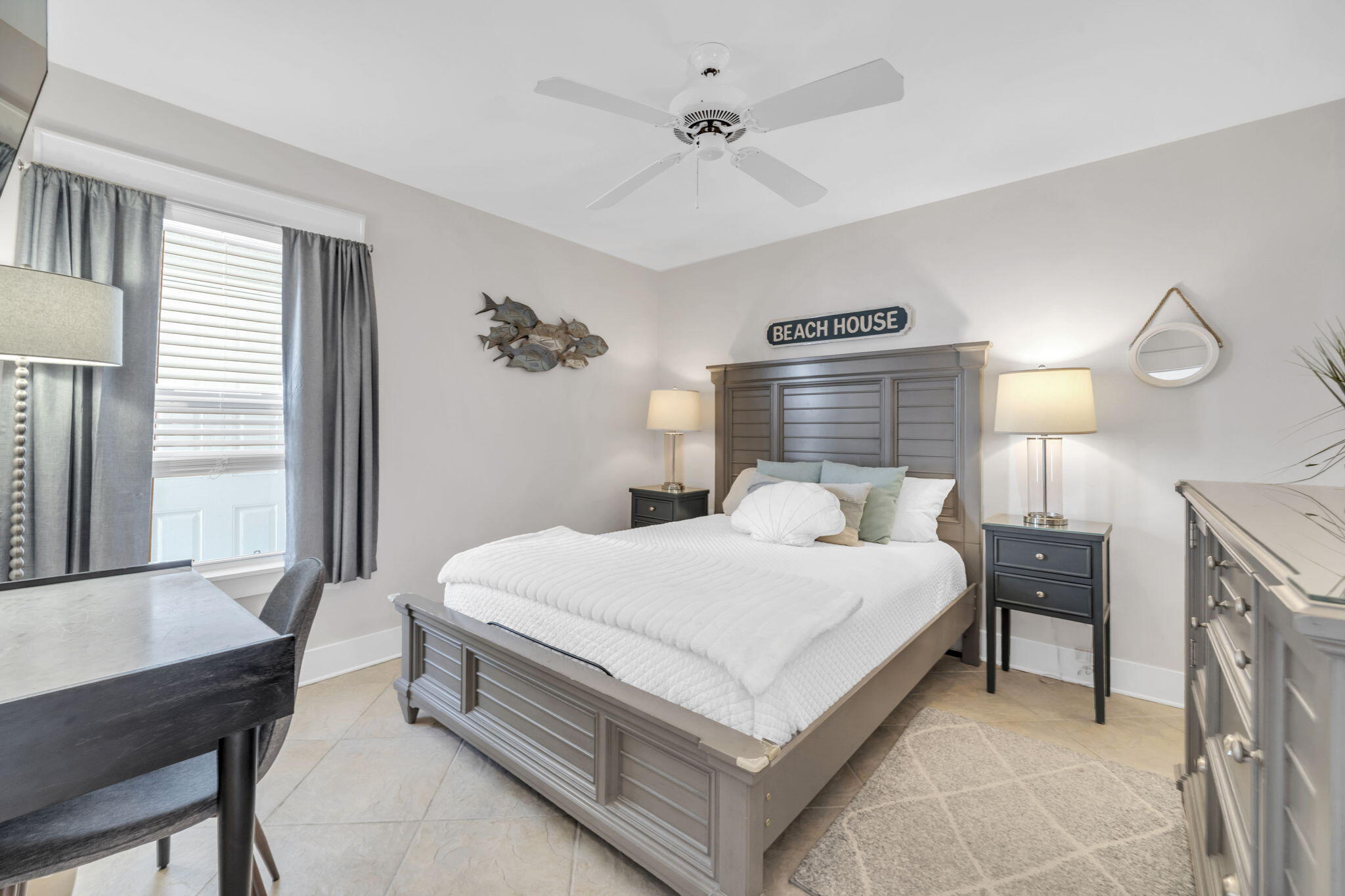 4984 West County Highway 30A, Unit 4B Santa Rosa Beach, FL 32459 - Photo 7 of 37 a bedroom with a bed a table and chair