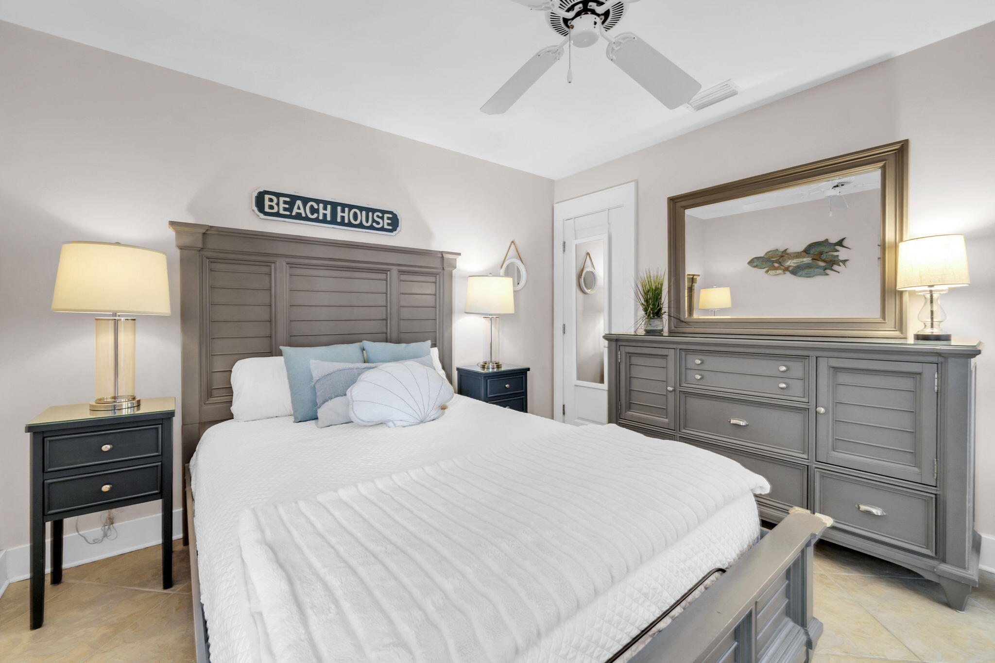 4984 West County Highway 30A, Unit 4B Santa Rosa Beach, FL 32459 - Photo 8 of 37 a bedroom with a bed and a lamp on dresser
