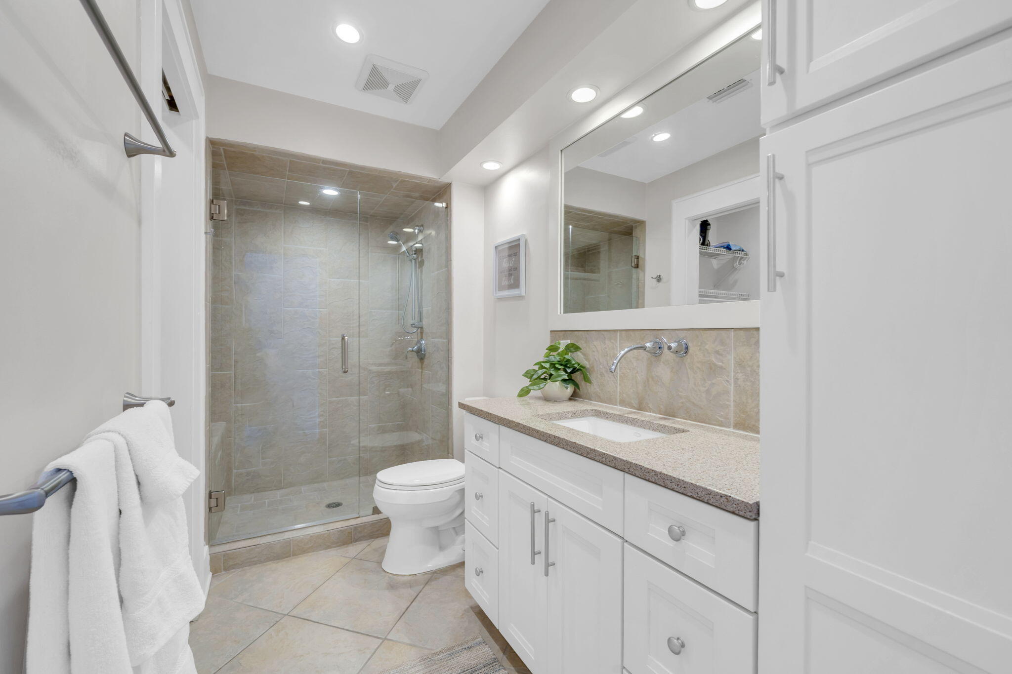 4984 West County Highway 30A, Unit 4B Santa Rosa Beach, FL 32459 - Photo 10 of 37 a bathroom with a granite countertop sink a toilet and shower