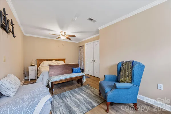 a bedroom with furniture and a couch