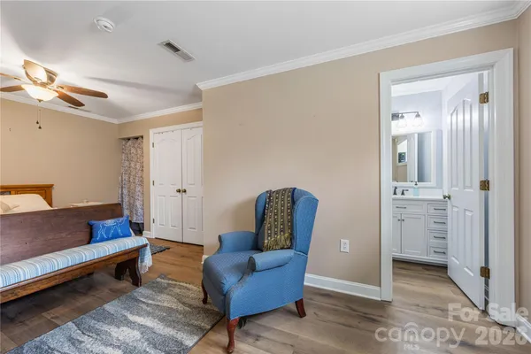 a living room with furniture and a dining table