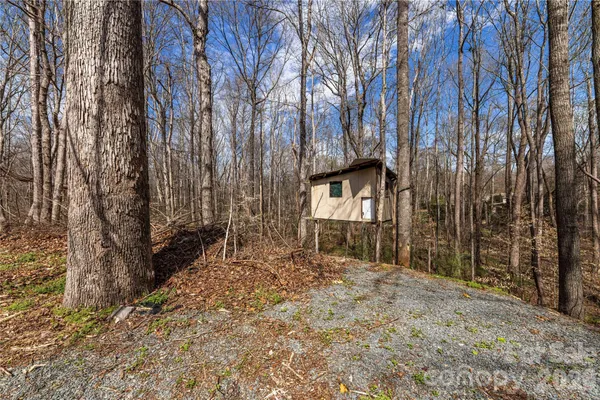 a view of a backyard of the house