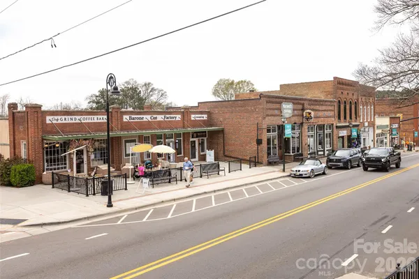a view of a street with cars