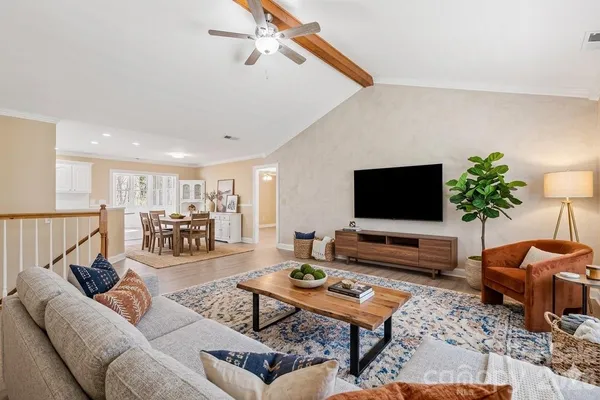 a living room with furniture and a flat screen tv
