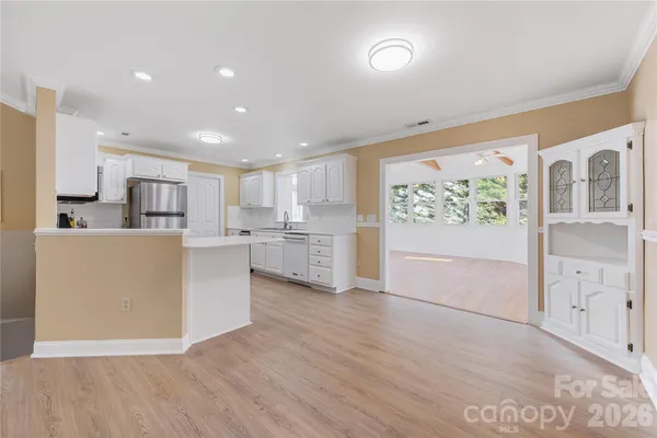 a view of kitchen with wooden floor