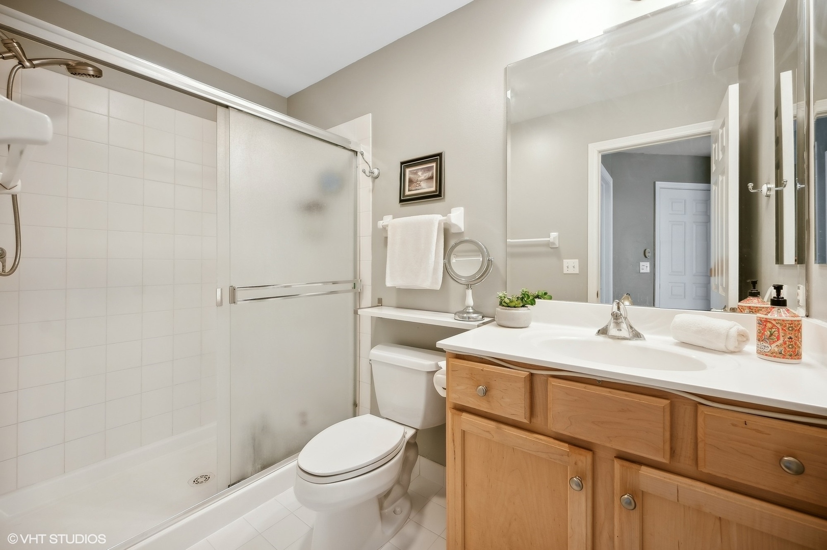 2703 Langley Circle Glenview, IL 60026 - Photo 12 of 23 a bathroom with a sink toilet and shower