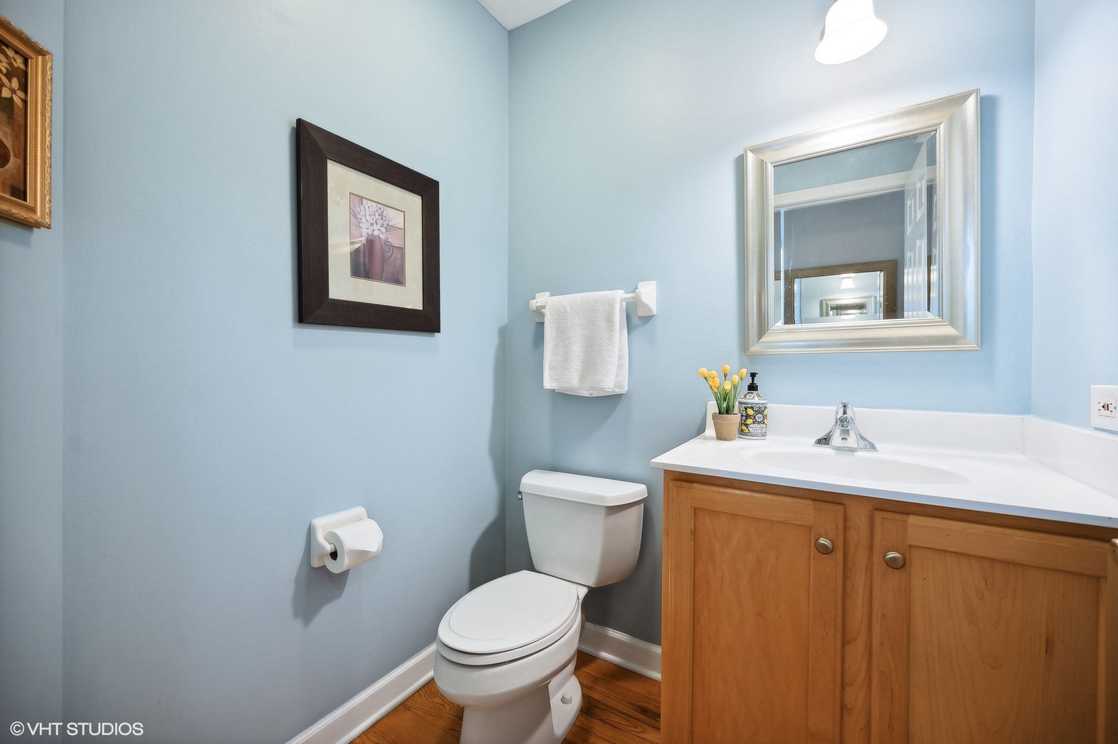 2703 Langley Circle Glenview, IL 60026 - Photo 9 of 23 a bathroom with a toilet sink vanity and mirror