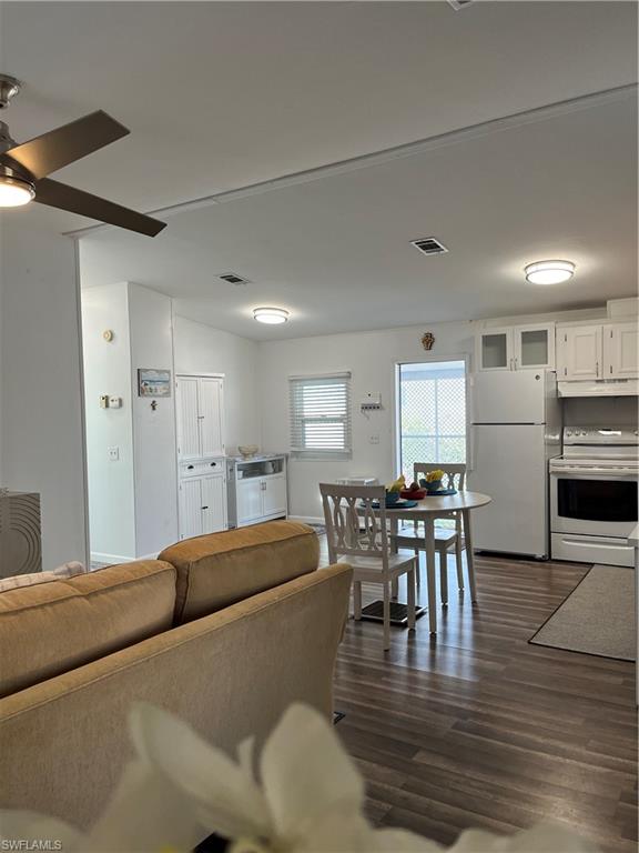 53 Oceans Boulevard, Unit 53 Naples, FL 34104 - Photo 11 of 42 a living room with stainless steel appliances furniture and kitchen view
