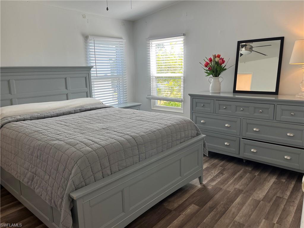 53 Oceans Boulevard, Unit 53 Naples, FL 34104 - Photo 14 of 42 a bedroom with a bed and a dresser