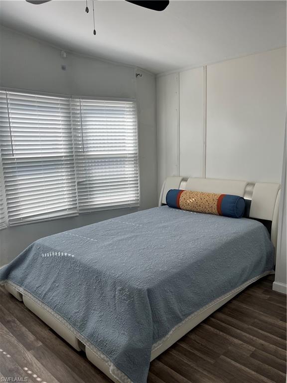 53 Oceans Boulevard, Unit 53 Naples, FL 34104 - Photo 22 of 42 a bedroom with a bed and window