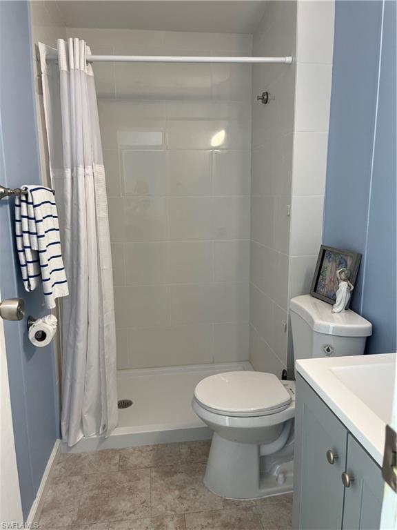 53 Oceans Boulevard, Unit 53 Naples, FL 34104 - Photo 25 of 42 a white toilet sitting next to a shower