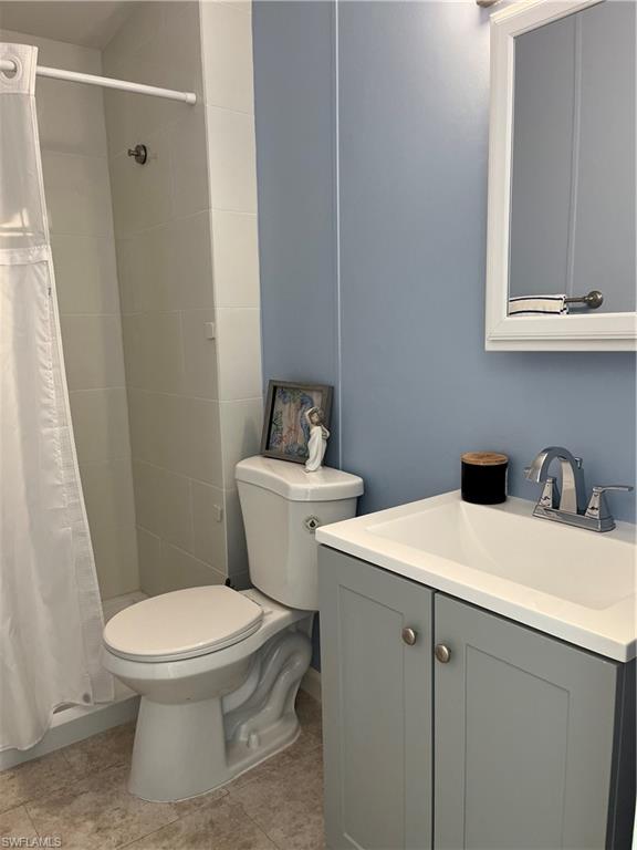 53 Oceans Boulevard, Unit 53 Naples, FL 34104 - Photo 26 of 42 a white toilet sitting next to a bathroom sink