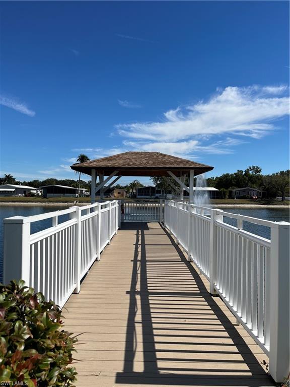 53 Oceans Boulevard, Unit 53 Naples, FL 34104 - Photo 27 of 42 a view of roof deck with wooden floor and city view