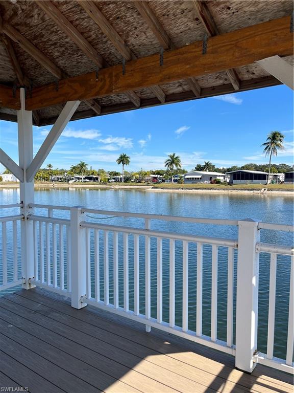 53 Oceans Boulevard, Unit 53 Naples, FL 34104 - Photo 29 of 42 a view of a balcony with wooden floor