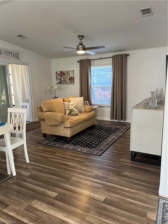 53 Oceans Boulevard, Unit 53 Naples, FL 34104 - Photo 6 of 42 a living room with furniture and a rug
