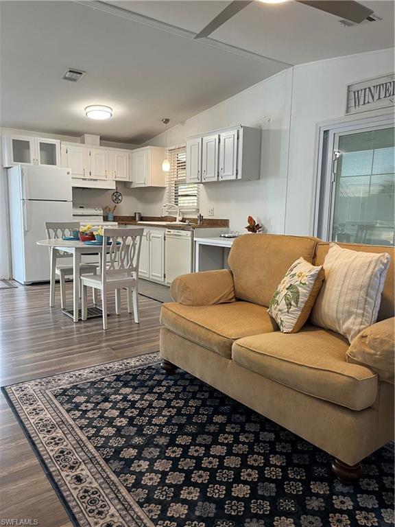 53 Oceans Boulevard, Unit 53 Naples, FL 34104 - Photo 7 of 42 a living room with stainless steel appliances furniture and a view of kitchen