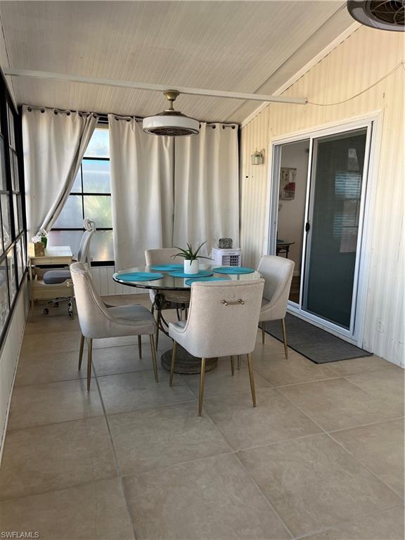 53 Oceans Boulevard, Unit 53 Naples, FL 34104 - Photo 10 of 42 a view of a dining room with furniture and a window