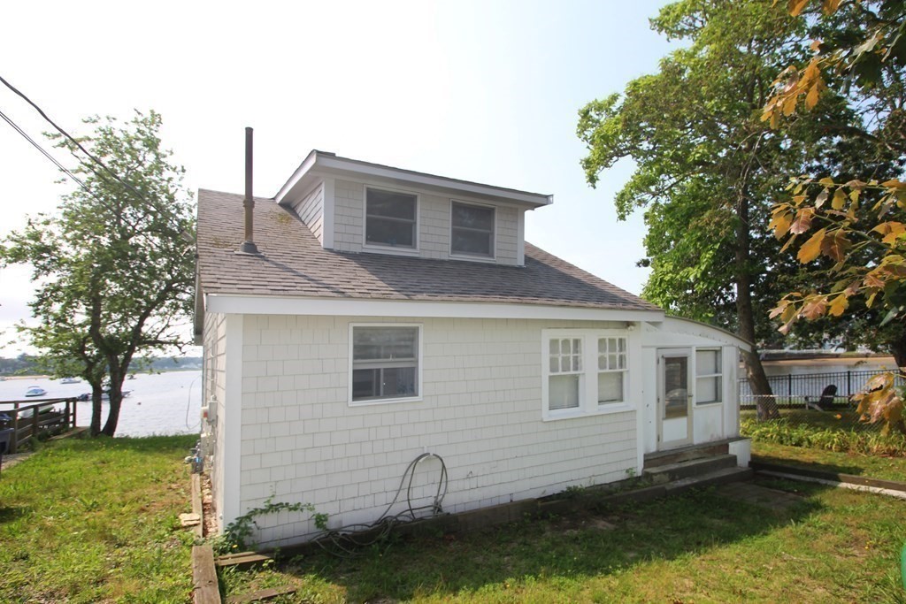 12 B Barnacle Road Wareham, MA 02571 - Photo 3 of 14 a front view of a house with a yard