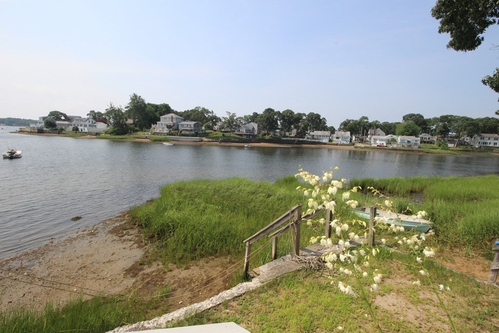 12 B Barnacle Road Wareham, MA 02571 - Photo 4 of 14 a view of a lake with houses in the back