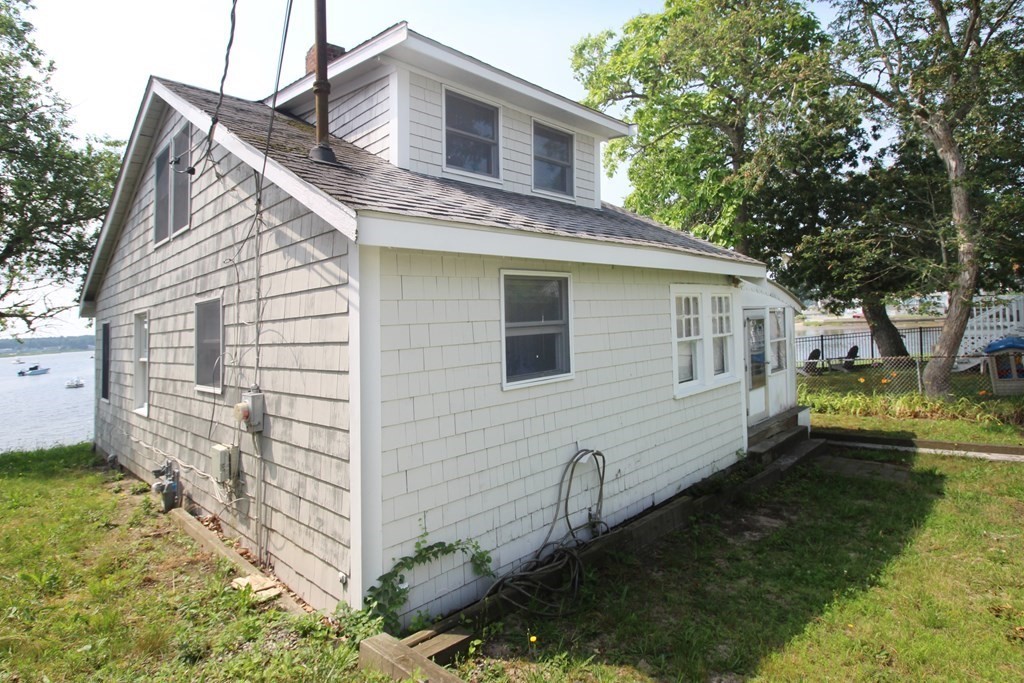12 B Barnacle Road Wareham, MA 02571 - Photo 5 of 14 a view of a house with a yard