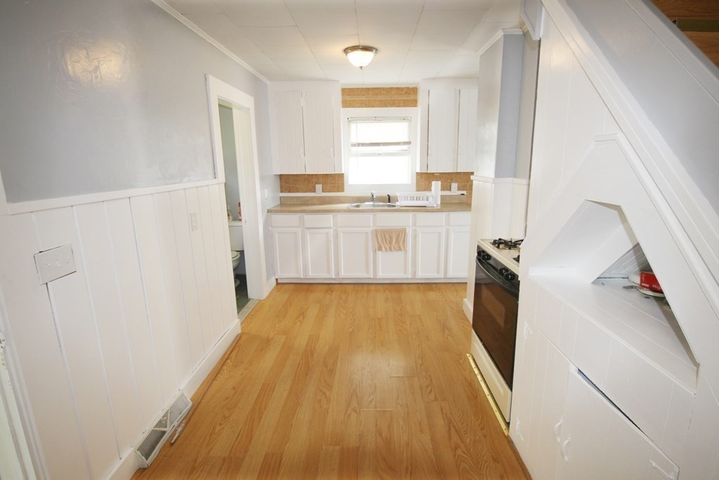 12 B Barnacle Road Wareham, MA 02571 - Photo 7 of 14 a view of a kitchen with wooden floor and electronic appliances