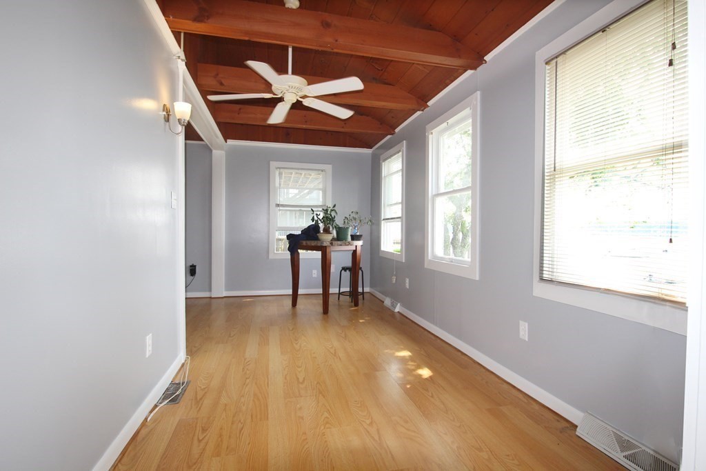 12 B Barnacle Road Wareham, MA 02571 - Photo 9 of 14 a view of an empty room with window and wooden floor