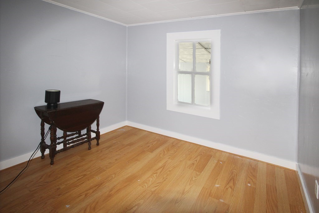 12 B Barnacle Road Wareham, MA 02571 - Photo 10 of 14 a view of a workspace with wooden floor and a window