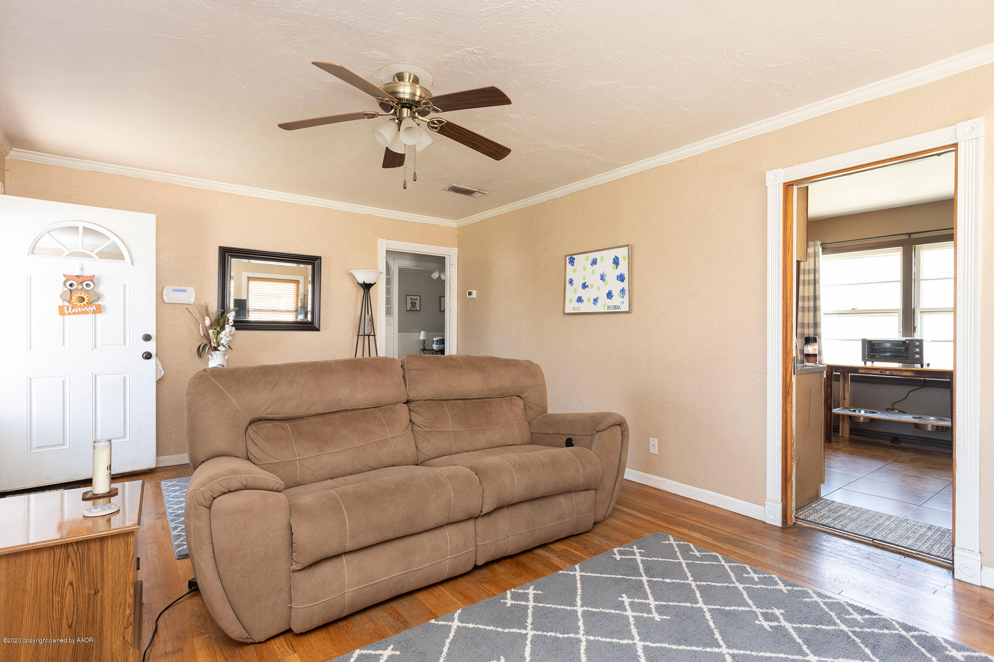 4222 Gables Street Amarillo, TX 79110 - Photo 5 of 18 a living room with furniture and a walk in closet