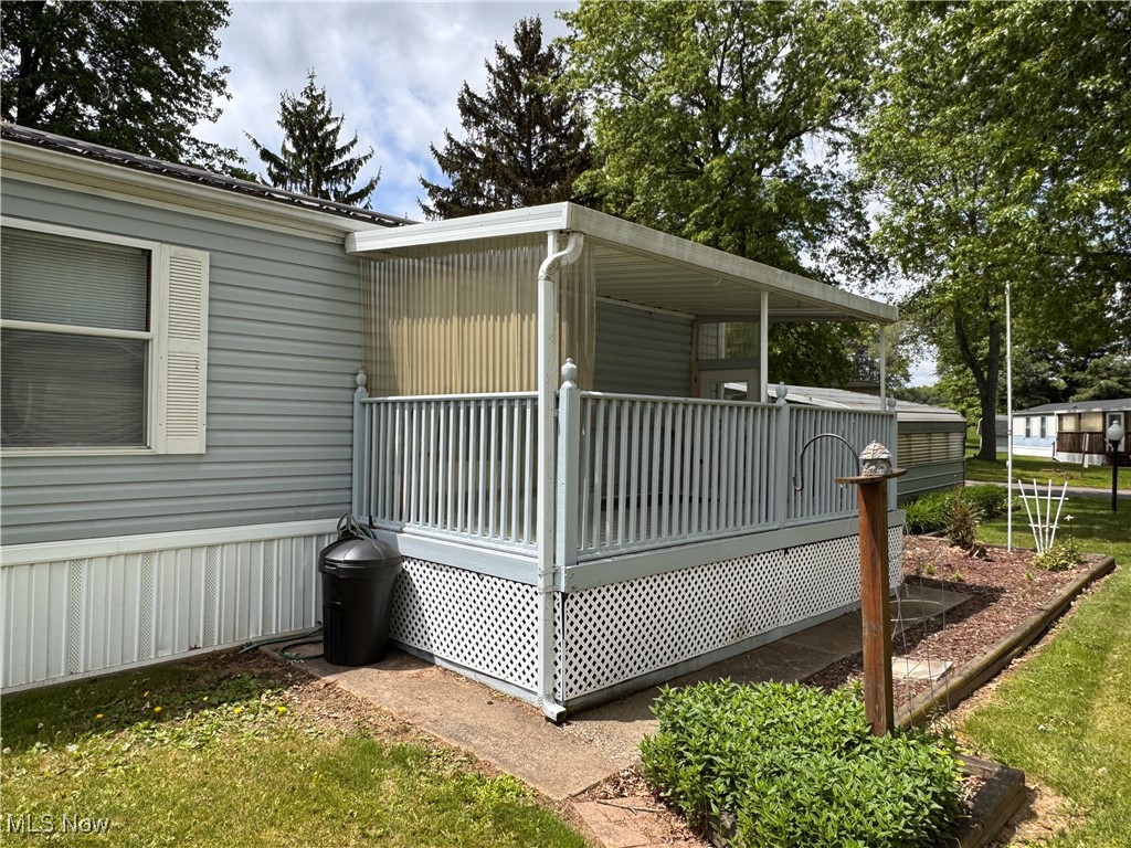 5852 Cleveland Road, Unit 104 Wooster, OH 44691 - Photo 5 of 36 View of side of property/porch