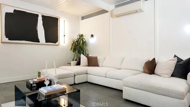 a living room with furniture and a table