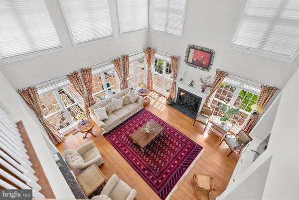 a kitchen with stainless steel appliances granite countertop a refrigerator a sink and a stove