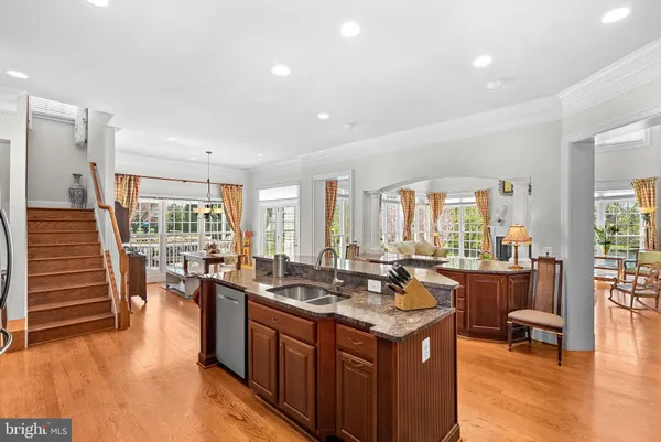 a room with furniture a small book shelf and a window