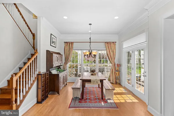 a view of stairs and hall with wooden floor