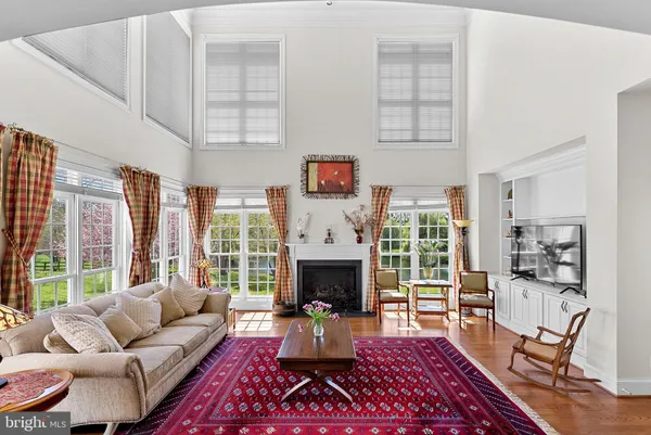 a living room with furniture and a rug