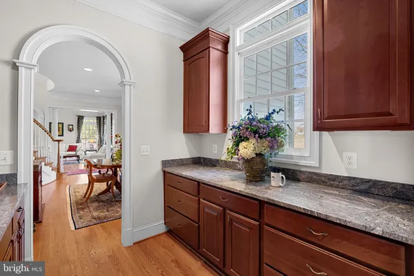 a bedroom with a balcony a bed and a large window