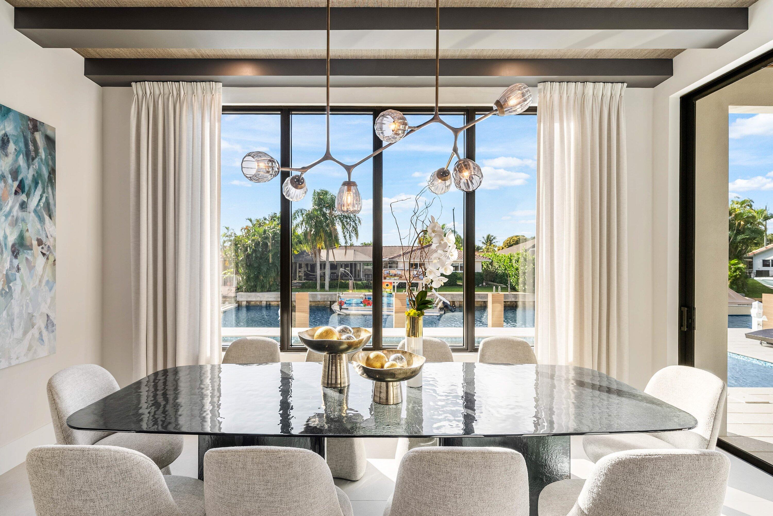 728 Enfield Street Boca Raton, FL 33487 - Photo 13 of 50 a dining room with furniture a chandelier and living room view