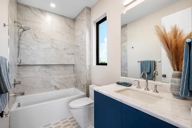 a bathroom with a sink a toilet and a bathtub